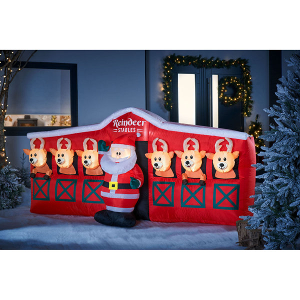 The Seasonal Aisle Santa and Reindeer Stables Inflatable Wayfair.co.uk